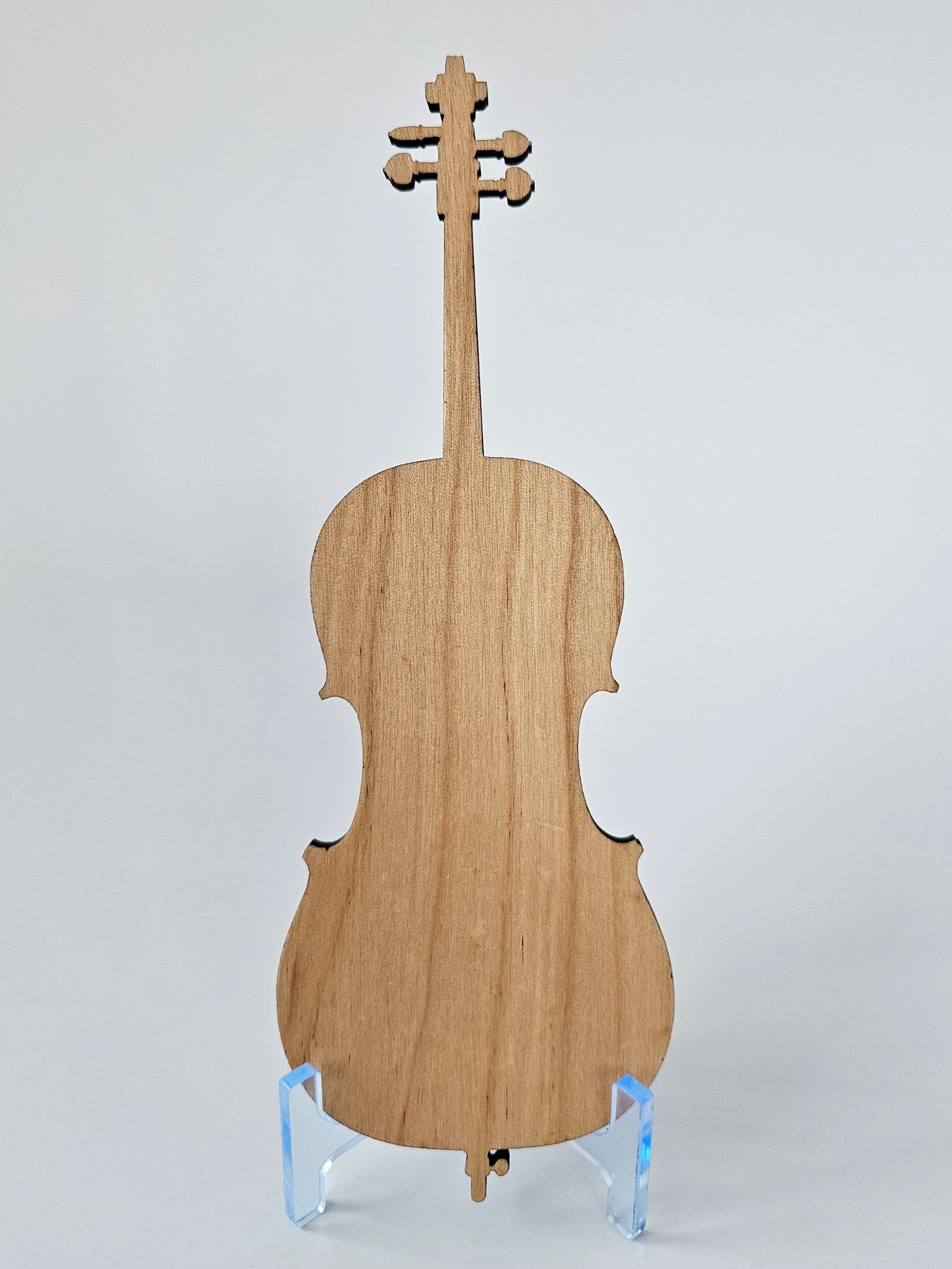 Back view of mini cello on clear stand with a white background